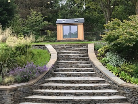Highlander 1 nestled in a beautiful landscaped garden designed by Mhairi Auld Garden Design